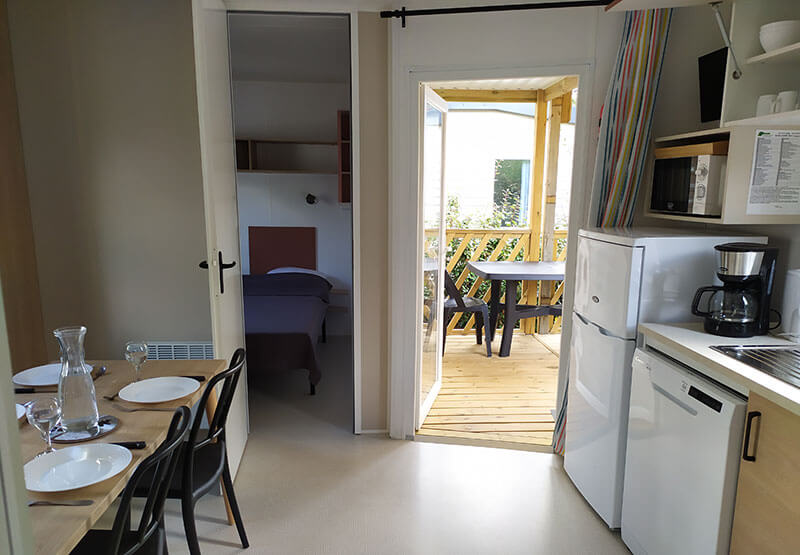 dining and kitchen area with access to the terrace