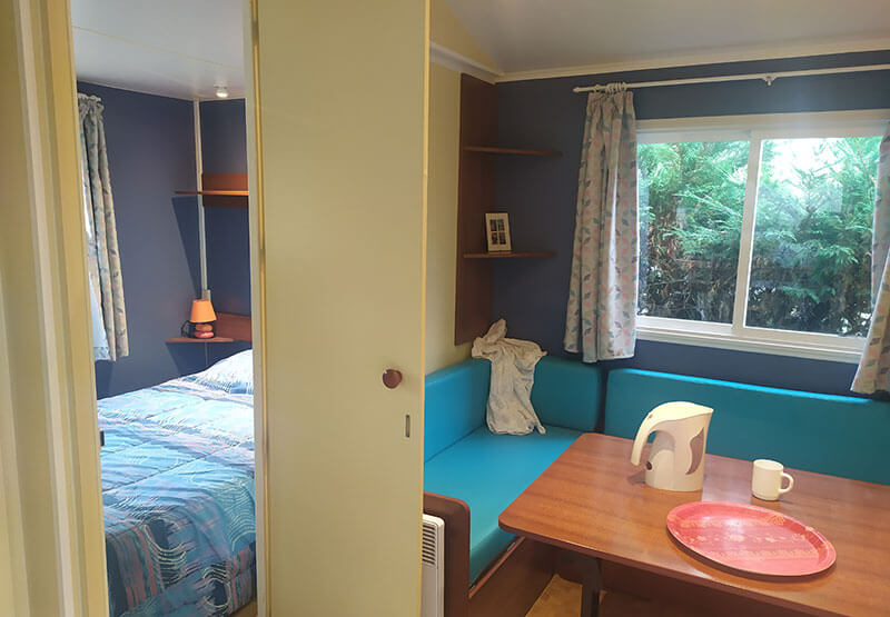 dining area and view of double bedroom